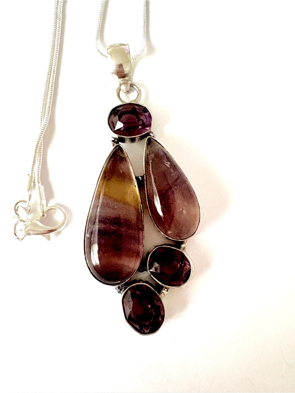 2 inch, 925  marked, 2 Fluorite and 3 Amethyst gemstones on a silver chain .
